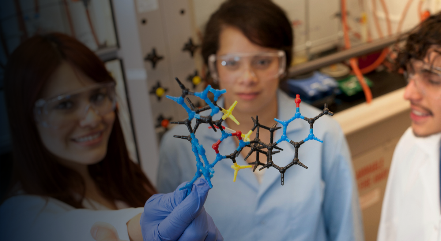 A student holding an item